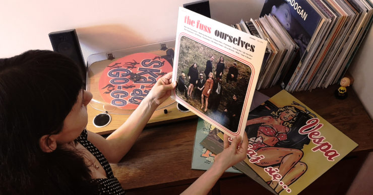 Woman holding a rocksteady vinyl record